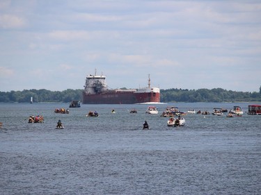 It's always important to stay in your lane at the Tubie Festival, especially when there's a ship in the channel. Photo on Sunday, August 31, 2022, in Morrisburg, Ont. Todd Hambleton/Cornwall Standard-Freeholder/Postmedia Network