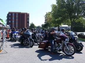 Riders leave the parking lot on Second Street to begin the charity ride for Carefor Hospice Cornwall on Saturday August 6, 2022 in Cornwall, Ont. Laura Dalton/Cornwall Standard-Freeholder/Postmedia Network