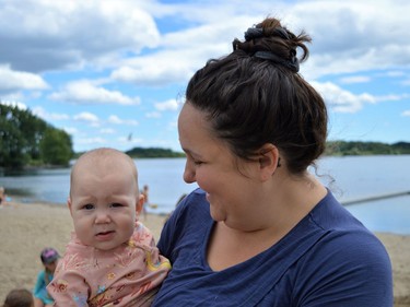 Ivy hanging out with mom Maegan Delorme at the Iroquois Beach Day on Friday August 12, 2022 in South Dundas, Ont. Shawna O'Neill/Cornwall Standard-Freeholder/Postmedia Network