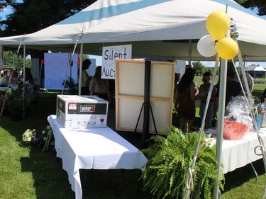 The silent auction tent at Paul Rozon Memorial Park. Photo on Saturday, August 13, 2022, in Williamstown, Ont. Todd Hambleton/Cornwall Standard-Freeholder/Postmedia Network