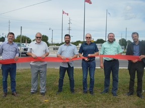 From left to right: Glengarry--Prescott--Russell MP Francis Drouin, Deputy Warden Al Armstrong, Coco Paving's Shaun Smith, South Dundas Mayor Steven Byvelds, SDSG MP Eric Duncan, and SDG infrastructure manager Mike Jans. The group of local dignitaries came together to celebrate and cut the ribbon to the completed Morrisburg roundabout and streetscape on Thursday August 18, 2022 in Cornwall, Ont. Shawna O'Neill/Cornwall Standard-Freeholder/Postmedia Network