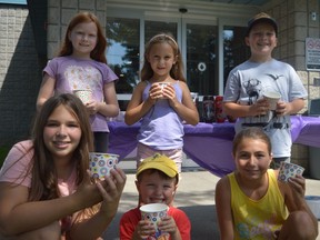 Back row, from left to right: Vanessa Sullivan-Winter, Lexi Belanger, and Louka Papadakis. Front row, from left to right: Raygan Lafleche, Caleb McBean, and Taya Dumaine. All children had a sweet time at Sundae Funday outside of the Long Sault Arena on Friday August 19, 2022 in South Stormont, Ont. Shawna O'Neill/Cornwall Standard-Freeholder/Postmedia Network