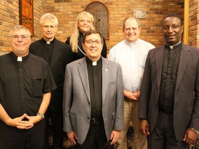 Clergy members celebrated for their outstanding contributions to the CTC Bike-A-Thon event are (in front, from left), Rev. Louis Groetelaars, Rev. Marc Piche and Rev. Augustine Chike Obago. In back are Rev. Dan Van Delst, Rev. Lois Gaudet and Rev. Claude Thibault. Photo on Thursday, August 25, 2022, in Cornwall, Ont. Todd Hambleton/Cornwall Standard-Freeholder/Postmedia Network