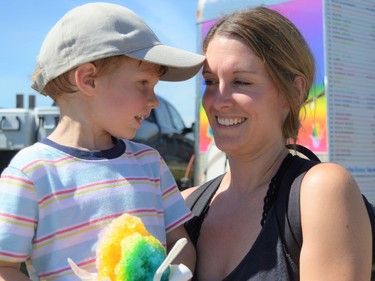 Weston Fox (left) was excited to dig into his snow cone with Katie Sommerville at the fair on Sunday August 28, 2022 in Chesterville, Ont. Shawna O'Neill/Cornwall Standard-Freeholder/Postmedia Network