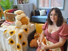 Claire Bonk of Amethyst Claire handcrafted, crocheting on site and showing off her creations during the Makers Pop-Up at WBHUB on Saturday August 27, 2022 in Cornwall, Ont. Shawna O'Neill/Cornwall Standard-Freeholder/Postmedia Network