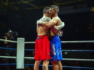 Cornwall's Tony Luis and Calgary's Steve Claggett hug it out on Monday August 8, 2022 in Cornwall, Ont. Luis conceded the fight at the start of the seventh round. Robert Lefebvre/Special to the Cornwall Standard-Freeholder/Postmedia Network