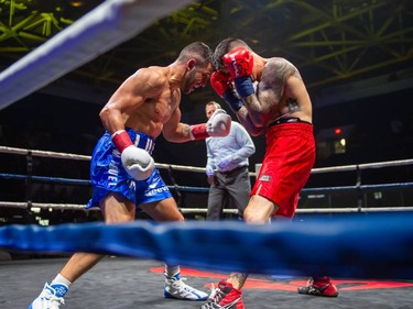 Cornwall's Tony Luis, right, goes for the midsection against Calgary's Steve Claggett on Monday August 8, 2022 in Cornwall, Ont. Luis conceded the fight at the start of the seventh round. Robert Lefebvre/Special to the Cornwall Standard-Freeholder/Postmedia Network