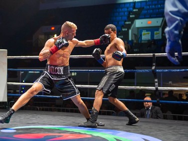 Hamilton's Jessie Wilcox, left, swings at Ricardo Lara on Monday August 8, 2022 in Cornwall, Ont. Wilcox knocked Lara out in the third round. Robert Lefebvre/Special to the Cornwall Standard-Freeholder/Postmedia Network