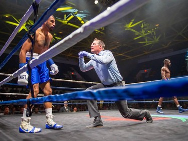 Luis Guerrero Ochoa getting the referee's count as Toronto's Adrian Bembridge paces in the background on Monday August 8, 2022 in Cornwall, Ont. Bembridge knocked out his opponent near the end of the first round. Robert Lefebvre/Special to the Cornwall Standard-Freeholder/Postmedia Network