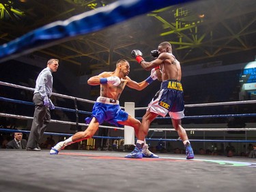 Toronto's Adrian Bembridge, right, takes a shot from Luis Guerrero Ochoa on Monday August 8, 2022 in Cornwall, Ont. Bembridge knocked out his opponent near the end of the first round. Robert Lefebvre/Special to the Cornwall Standard-Freeholder/Postmedia Network