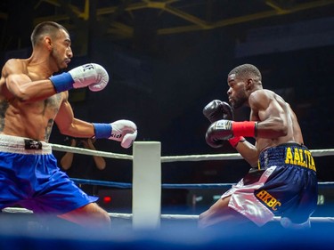 Toronto's Adrian Bembridge, right, faces off against Luis Guerrero Ochoa on Monday August 8, 2022 in Cornwall, Ont. Bembridge knocked out his opponent near the end of the first round. Robert Lefebvre/Special to the Cornwall Standard-Freeholder/Postmedia Network
