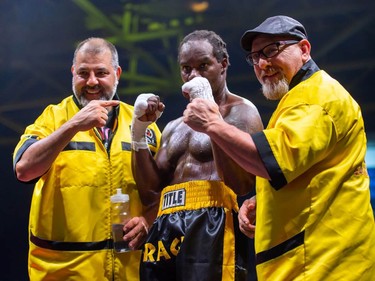 Ottawa's Roody Rene, centre, with his coaching team after winning a judges' decision against Darren Fletcher, of Brantford, Ont. on Monday August 8, 2022 in Cornwall, Ont. Robert Lefebvre/Special to the Cornwall Standard-Freeholder/Postmedia Network