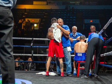 Cornwall's Tony Luis faces his corner as his manager and dad Jorge speaks with Calgary's Steve Claggett on Monday August 8, 2022 in Cornwall, Ont. Luis conceded the fight at the start of the seventh round. Robert Lefebvre/Special to the Cornwall Standard-Freeholder/Postmedia Network