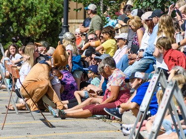 Spectators wait for outhouse race action in Cochrane on Sunday, Aug. 28, 2022.