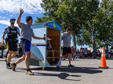 The Cochrane RCMP team at the outhouse races in Cochrane on Sunday, Aug. 28, 2022.