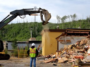 Work crews demolish the old A&W restaurant on the corner of Franklin Avenue and Morrison Street in downtown Fort McMurray on Wednesday, August 3, 2022. Laura Beamish/Fort McMurray Today/Postmedia Network