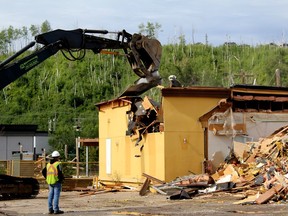 Work crews demolish the old A&W restaurant on the corner of Franklin Avenue and Morrison Street in downtown Fort McMurray on Wednesday, August 3, 2022. Laura Beamish/Fort McMurray Today/Postmedia Network