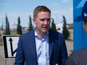 Minister Jeremy Cockrill speaks to media in July about highway upgrades.