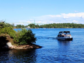 Guests arrive by pontoon boat shuttle for the 15th Annual Summer Evening in the Islands for the Thousand Islands History Museum held on Flying Mallard Island on August 11.  For Lorraine Payette/Postmedia Networks