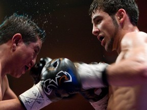 Tony Luis (R) and Carlos Martinez (L) fight in the Budweiser boxing series presented at the Montreal casino on March 7, 2009.
