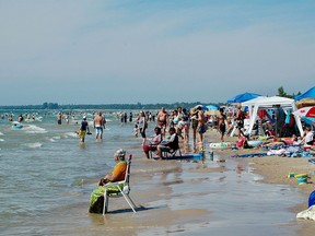 Thousands of visitors crowd the beach  Saturday, Aug. 8, 2022 at Sauble Beach. (Scott Dunn/The Sun Times/Postmedia Network)