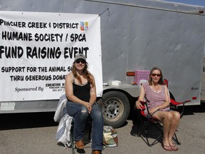 Haxstyn Peters, secretary on the Pincher Creek Humane Society and SPCA board, and Barb Schramm, board member, sat in the Ranchland Mall Co-op parking lot in the morning on August 6 for their bottle drive fundraising event.