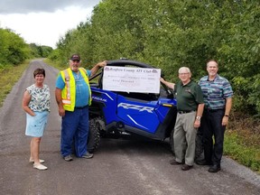 The Renfrew County ATV Club has donated $40,000 to the County of Renfrew to be put towards the Algonquin Trail. Taking part in the cheque presentation (from left) were Renfrew County Warden Debbie Robinson; Cameron Hann, president of RC ATV Club; County Councillor Robert Sweet, chair of the Development and Property Committee and Craig Kelley, director of Development and Property. County of Renfrew photo