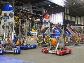 Several remotely controlled robots scurry around an arena picking up balls and placing them in repositories during the  FIRST (For the Inspiration and Recognition of Science and Technology) Robotics Competition Ontario District Western University Event at Thompson Arena in London, Ont. on Sunday April 7, 2019. Forty teams of high school students from across the province competed in the weekend long event. Ottawa Valley Power Play in downtown Pembroke is launching a FIRST Robotics club for area youth this September. Derek Ruttan