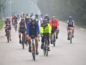 Participants in the 70-kilometre Winding Past Windmills ride battle through an early rain shower during the 2022 Gran Fondo Lake Huron presented by Bruce Power and Suppliers in Southampton on Sunday, August 21, 2022.
