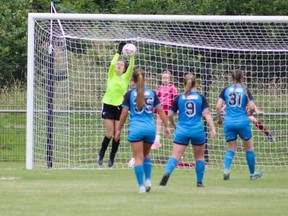 Ottawa City Soccer Club keeper Rose McCafferty of Petawawa leaps up to make a save during a game at the Super Cup NI tournament in Ireland. Submitted photo