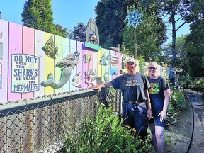 Bill Cole and Abby Obenchain pose with the children 's garden.