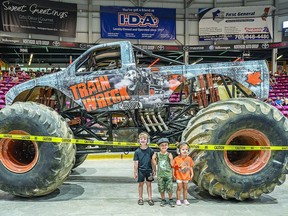 BIG ENOUGH Hudson Forbes, 4, Calvin Dufour, 4, and Ruby Forbes, 2, were fortunate enough to view the pit area before the start of Saturday's Monster Madness Tour at the GFL Memorial Gardens. The monster truck drivers and freestyle motocross cyclists delighted the sold out audience with stunts, best tricks and freestyle displays during the afternoon event. BOB DAVIES
