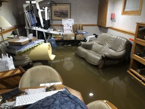 Sarnia resident David Wood took this photo after about a foot of water flooded his basement last Thursday. The city said it's offering curbside pickup of flood-damaged items on Thursday for residents who don't have removal covered by insurance. (David Wood photo)