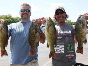 Darryl Boismier, left, and Rick Damphouse pose with some of the bass they caught during a Great Lakes Super Series tournament stop in Sarnia.  Weigh-in was at the Sarnia Bay Marina.  (Tyler Kula/ The Observer)