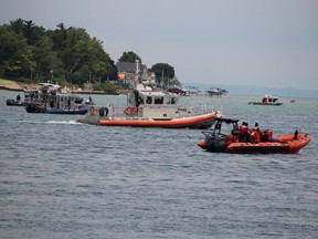 Rescue vessels wait Sunday in Lake Huron off Sarnia and Port Huron, Michigan for the start of the St. Clair River Float Down.
