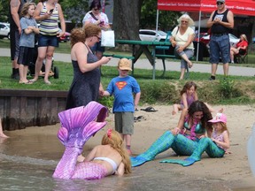 Mermaids, young and old, frolic at the beach in Brander Park Saturday during the Mermaids and Mariners festival in Port Lambton.