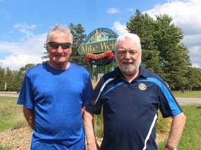 Henry Kulik, left, and Peter Fitzsimons, co-chairpersons of the Rotary Art in the Park Sarnia, stand at the entrance of Mike Weir Park in Bright's Grove where this year's sale will be held Sept. 10.