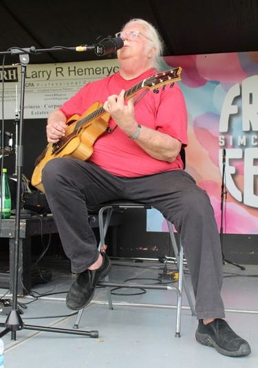 Thom Adkins of Sharp Dogs plays on the main stage Sunday, July 31 at the Simcoe Heritage Friendship Festival. Back-to-back performances by various artists were scheduled on the stage from Friday to Monday.  MICHELLE RUBY