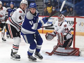 Evan Konyen, middle, of the Sudbury Wolves, follows the play during OHL action against the Niagara IceDogs at the Sudbury Community Arena in Sudbury, Ont. on Friday April 1, 2022. John Lappa/Sudbury Star/Postmedia Network