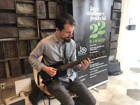 Jazz guitarist Jacob Starling performs prior to the start of a Jazz Sudbury press conference at Place des Arts Thursday. Harold Carmichael/Sudbury Star/Postmedia Network