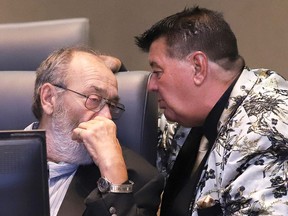Ward 2 Coun. Michael Vagnini, right, confers with Ward 3 Coun. Gerry Montpellier at a council meeting at Tom Davies Square in Sudbury, Ont. on Tuesday August 9, 2022. John Lappa/Sudbury Star/Postmedia Network