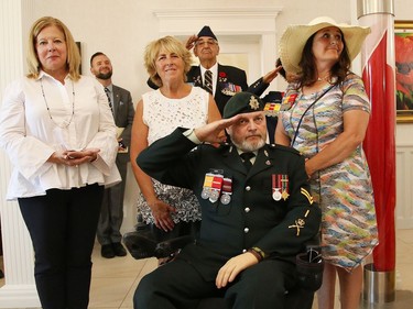 Sudbury MP Viviane Lapointe, left, AlgomaÑManitoulinÑKapuskasing MP Carol Hughes, veteran Bill Kerr and his wife Tracy, participate in a memorial service honouring Canadian soldiers who served in the Afghanistan conflict at the Cooperative Funeral Home in Sudbury, Ont. on Tuesday August 9, 2022. Kerr and his wife were honoured at the service. John Lappa/Sudbury Star/Postmedia Network