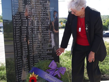 Claudette Roberge, mother of WO Gaetan Roberge, lays a wreath at a memorial wall of fallen soldiers at a memorial service honouring Canadian soldiers who served in the Afghanistan conflict at the Cooperative Funeral Home in Sudbury, Ont. on Tuesday August 9, 2022. John Lappa/Sudbury Star/Postmedia Network