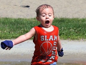 Noah Walsh, 18 months, plays at the splash pad at Victory Playground in Sudbury. Thursday will be warm, with a high of 28 degrees C and with a 40 per cent chance of rain. John Lappa/Sudbury Star/Postmedia Network