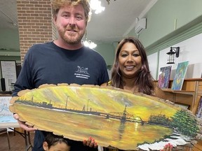 Patrick Keating and Asmita Pavel are excited about opening their new art gallery on Water Street in Little Current. Their two assistants, standing with them, are mighty helpers. Bonnie Kogos