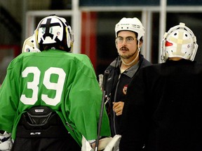 Former Timmins Majors coach Kevin Walker talks to pair of goalies during the GNU18L team's tryout camp at the McIntyre Arena on Saturday. Shortly before camp, it was announced Walker will be leaving the Majors to become coach and general manager of the SIJHL's Red Lake Miners. THOMAS PERRY/THE DAILY PRESS