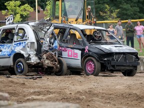 Devon Germain's Dodge Caravan, on the left, from Port Colborne, didn't have much of a rear end left at the Tillsonburg Fair demolition derby on Aug.  21, but it was solid enough to beat AJ Hunter's entry (on the right) from Tillsonburg.  CHRIS ABBOTT
