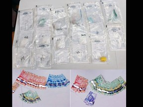 Substances and cash seized by Ontario Provincial Police from a residence in Napanee on Thursday.