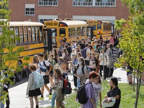 Students at Calvin Park Public School and Loyalist Collegiate, along with a variety of speciality programs at the facility, get ready to board buses home after the first day of the 2022-23 school year in Kingston on Tuesday.