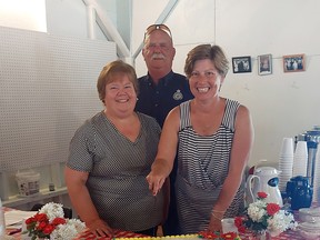 Elgin County Warden Mary French, West Elgin Mayor Duncan McPhail and Elgin--Middlesex--London MP Karen Vecchio prepare to cut the cake at the celebration of 101 years of the Port Glasgow dance pavilion. (Handout/Postmedia Network)